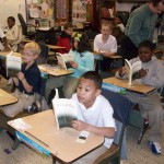 Four students getting a peek inside "A Good Place"