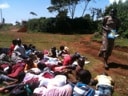 Sunday School class in the sun at Maranatha Baptist Church.  Children are acting out young Samuel being awakened by God.  
