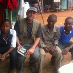 Curt at Entebbe Market with three new friends: an Ugandan, Congolese, and Tanzanian.