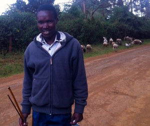Mchungaji (Shepherd)  Joshua with his roadside flock.