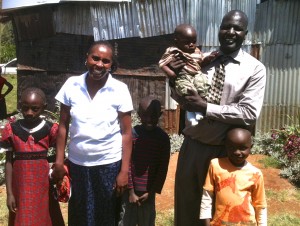 Mchungai (Pastor) Petero with his wife Ruth and family at their church