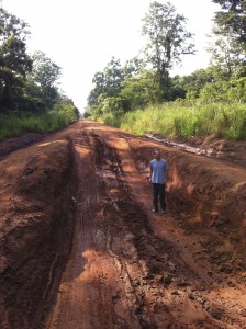 Bo in the Hole. Bo Smith standing in "Pothole" on African "Highway."