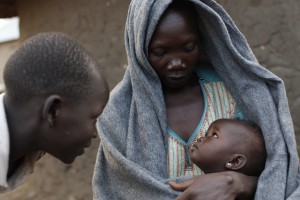 A displaced woman and her child at Faith Baptist Church in Nimule, South Sudan,