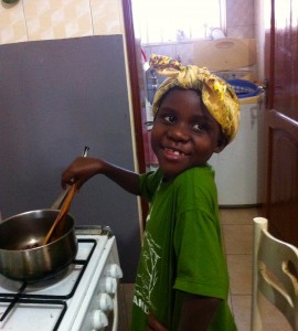 Daizy Thomas ala "Aunt Jemima" cooking at the Iles home.