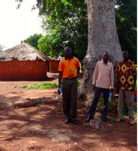 Zande church leaders Isaac and Felix stand under a tree where they plan to build a church in Tambura, South Sudan.