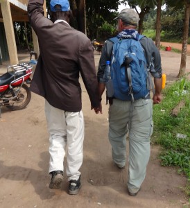 We'll miss the wonderful African hospitality.  Michael Wango leads Curth through Jombu Town, South Sudan.