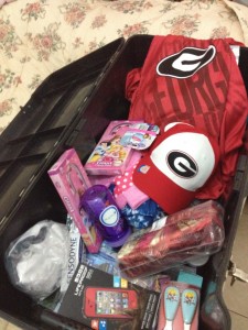 Care Package going to the Jeremiadoss family who serve in South Sudan.  It's all "Frozen" pink girlie things or Georgia Bulldog Red.
