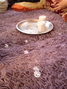 Hot sugared milk. Notice carpet. In Chad, you are always asked to sit on the carpet after removing your shoes.