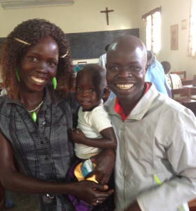 Pastor Evans Bebu and his wife and child.