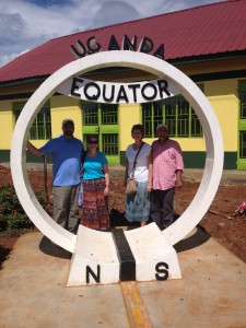 Todd and Jessica Burnaman at the Ugandan Equator with DeDe and me.