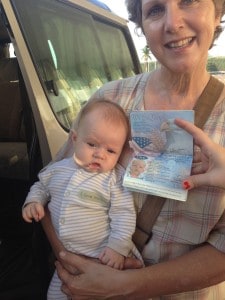 Roscoe Lane, with his passport, prepares for his first flight.  South Sudan bound.  DeDe holds him at Entebbe Airport.