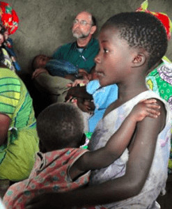 Holding a baby in a Congolese worship service.