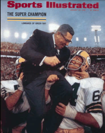 Jerry Kramer holds Vince Lombardi aloft. I believe this is actually from Super Bowl II. 