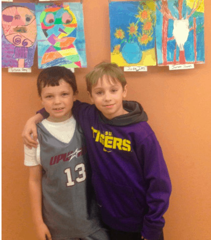 Cousins Jude Iles and Jack Iles with Jude's Sunflower Painting at Rapides Hospital. 