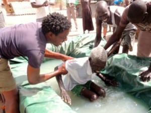 South Sudanese baptism. In spite of the ongoing war, God is working among our churches and friends.