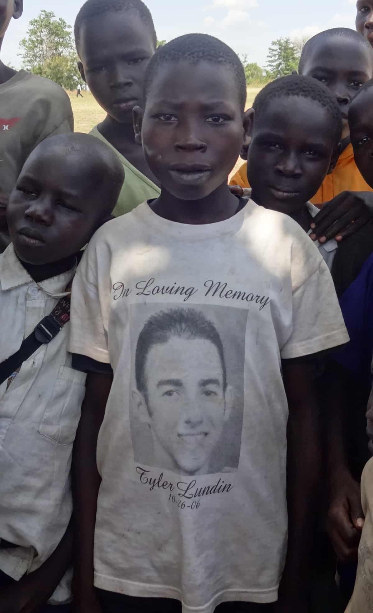 Tyler Lundin t-shirt worn by refugee boy at Rhino Camp in West Nile District, Uganda.